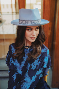 light blue hat with medium soft brim and upturn at the edges.