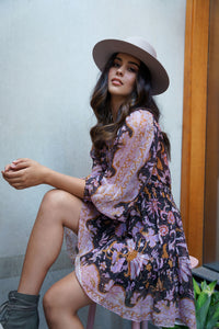 boater style hat in beige colour with purple, pink dress